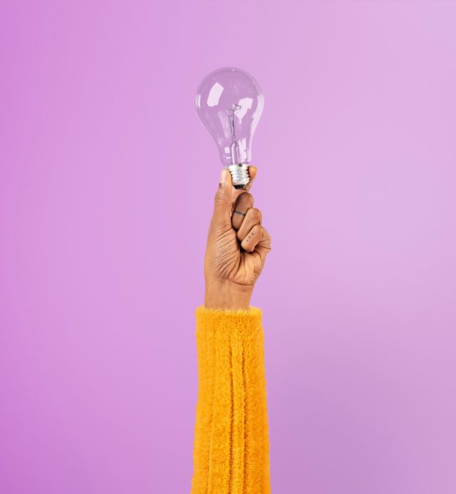 light-bulb-creative-business-idea-symbol-held-by-hand